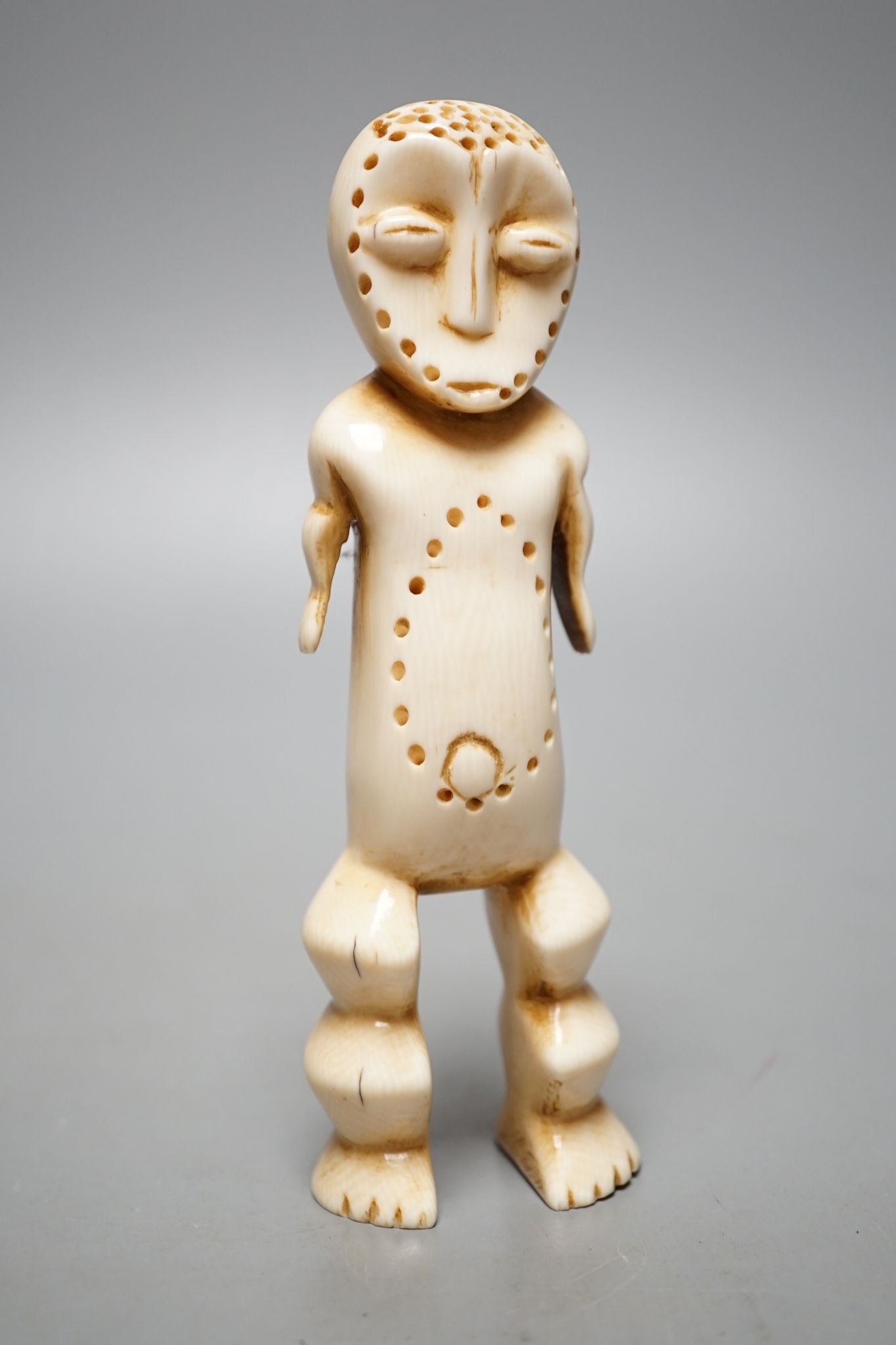 A Lega ivory figure, 15 cms high.